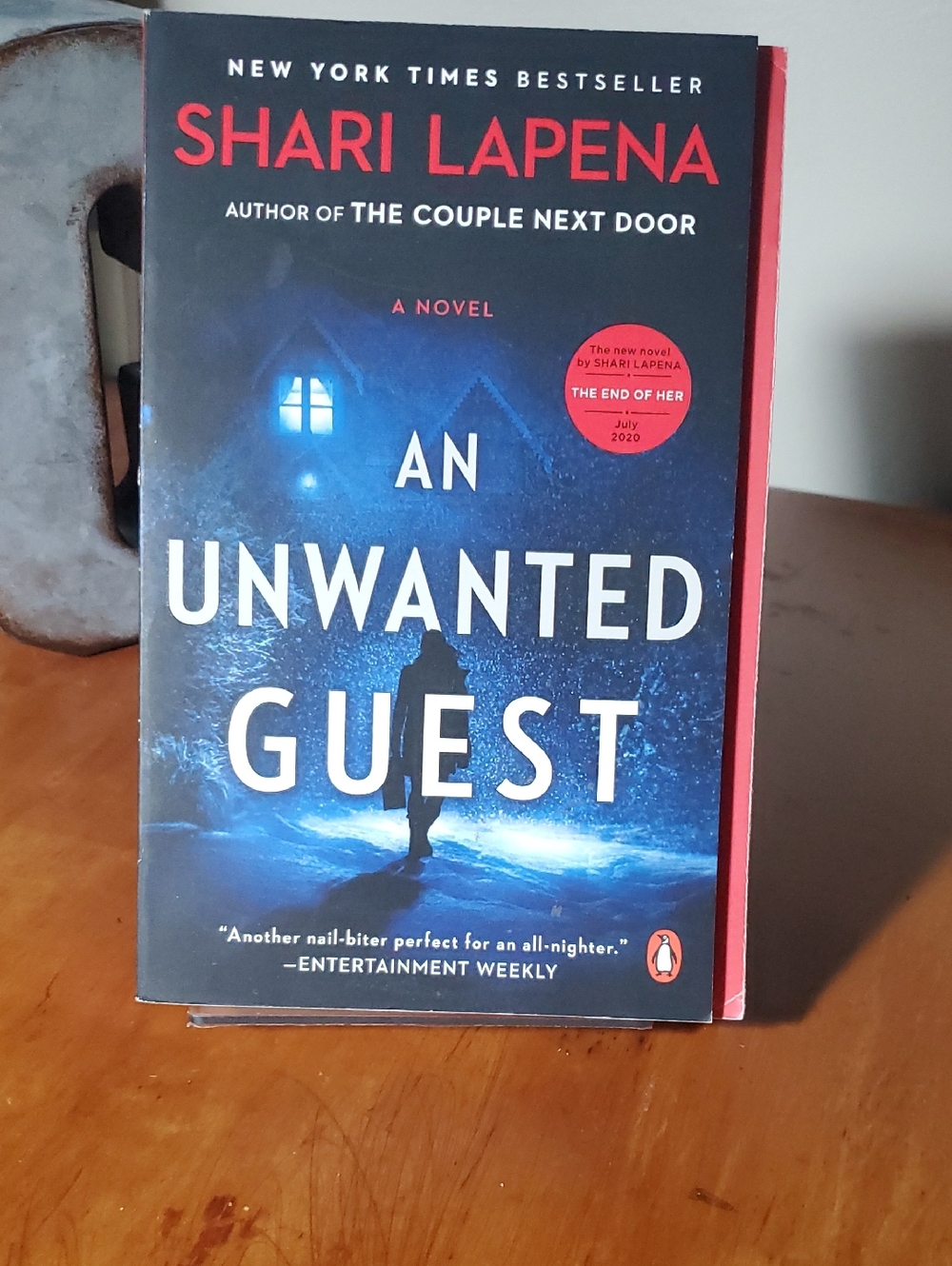 An Unwanted Guest by Shari Lapena - Blue Cover Paperback